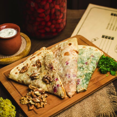 front-close-up-view-qutabs-with-meat-green-herbs-pumpkin-brown-desk